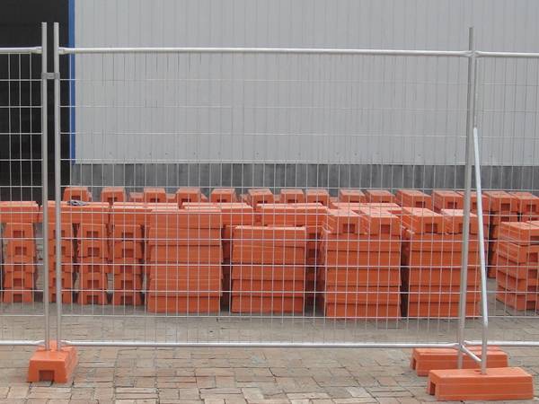 Australia temporary fence panels are inserted into plastic feet.