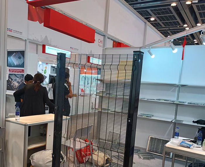 Our customer and our sales representative in the chain link fence warehouse.