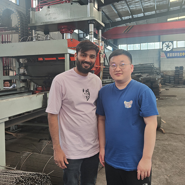 Our sales representative and our customers in the chain link fence warehouse.