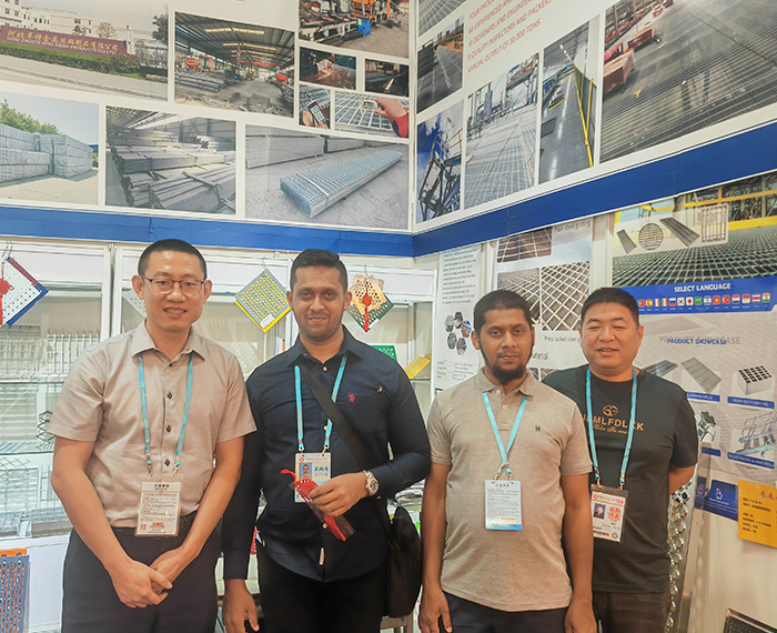 Our sales representative is standing in the booth of our exhibition in Paris.